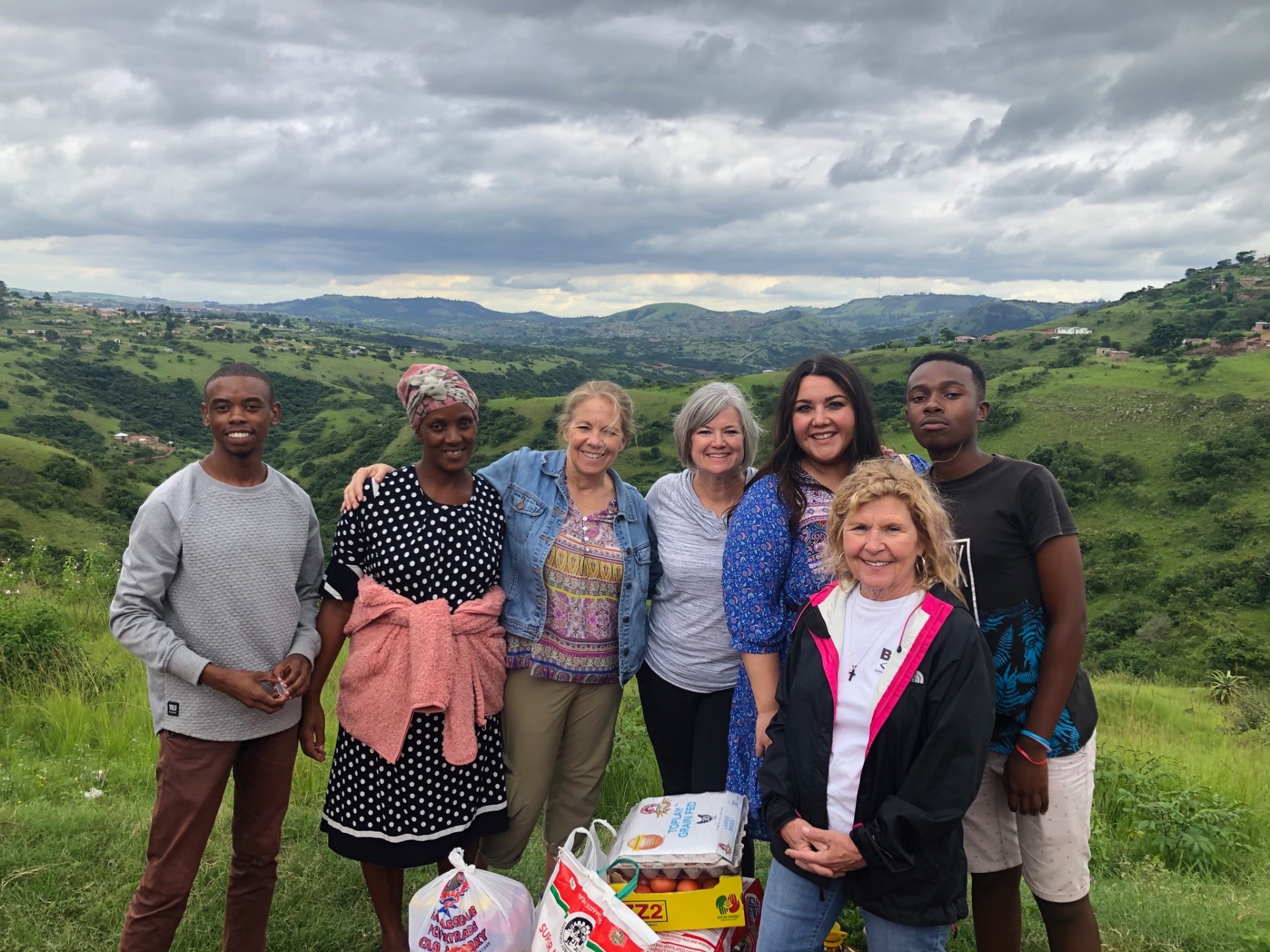 A hilltop food-parcel delivery to a Ntshongweni family