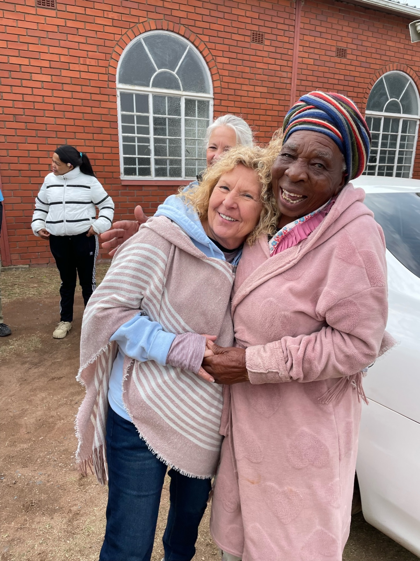 A gogo embraced at church