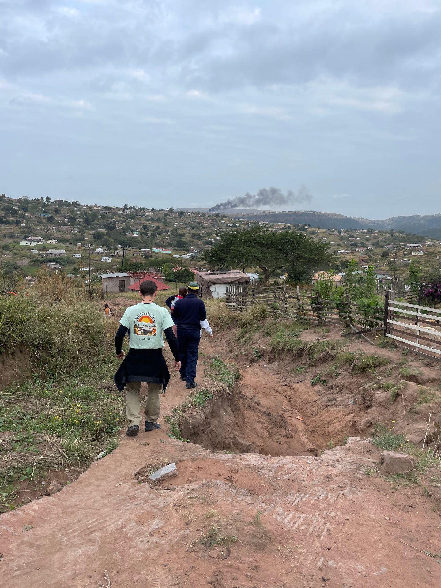 Walking the washed-out path to a flood-affected home