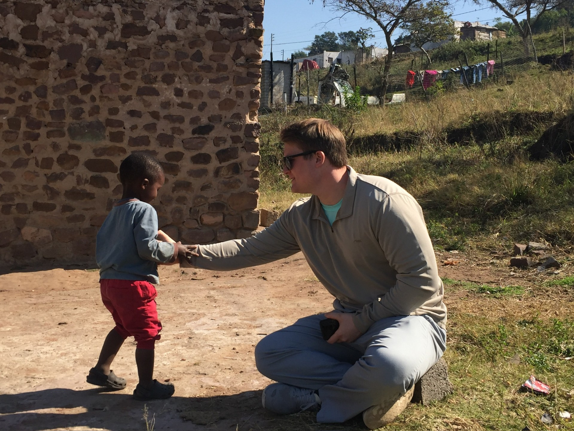 The Duma family outside their home in Ntshongweni