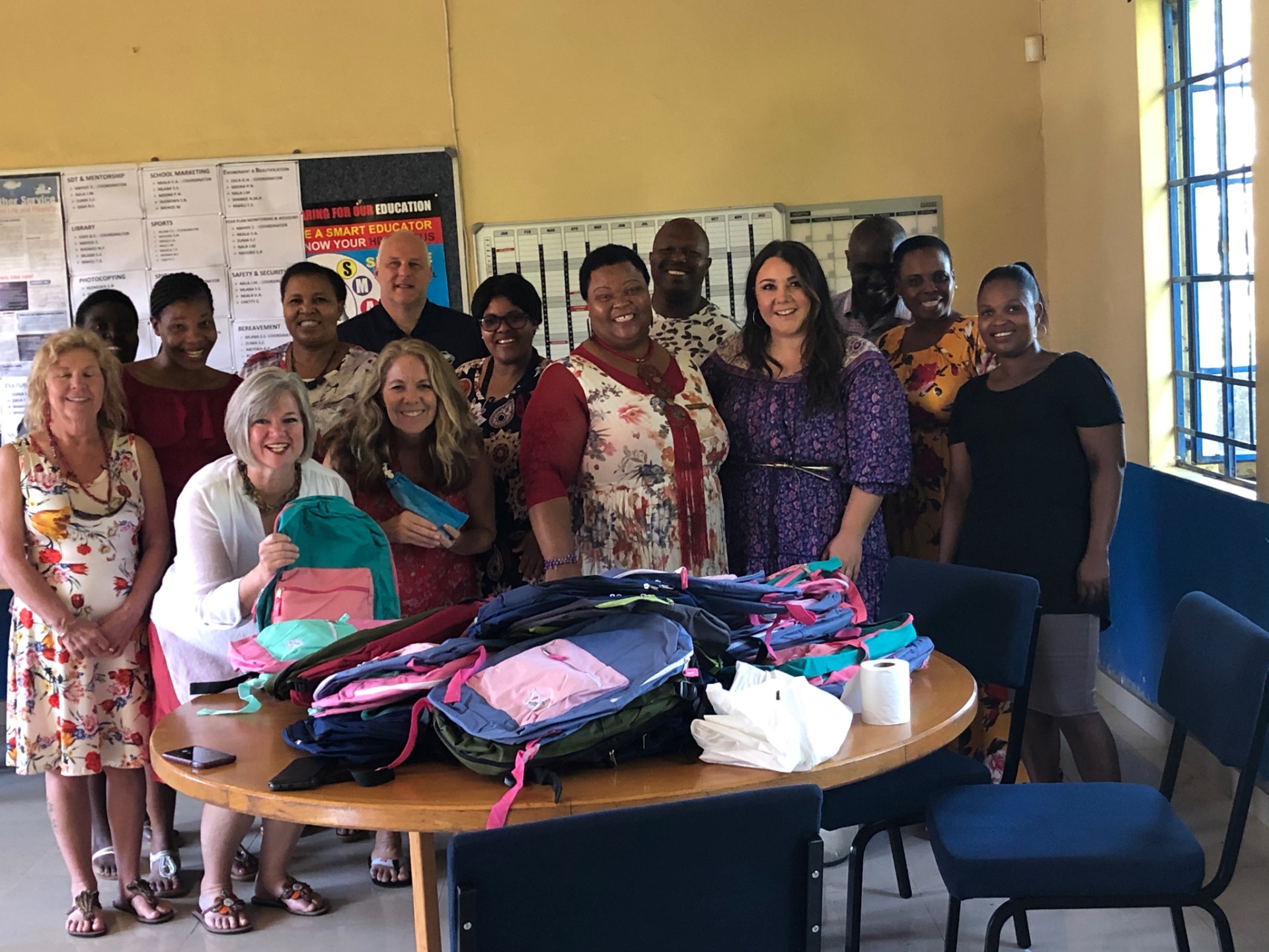 Backpacks and school supplies being handed to teachers in Ntshongweni