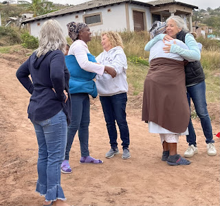 Zanele embraced by friends after losing her home