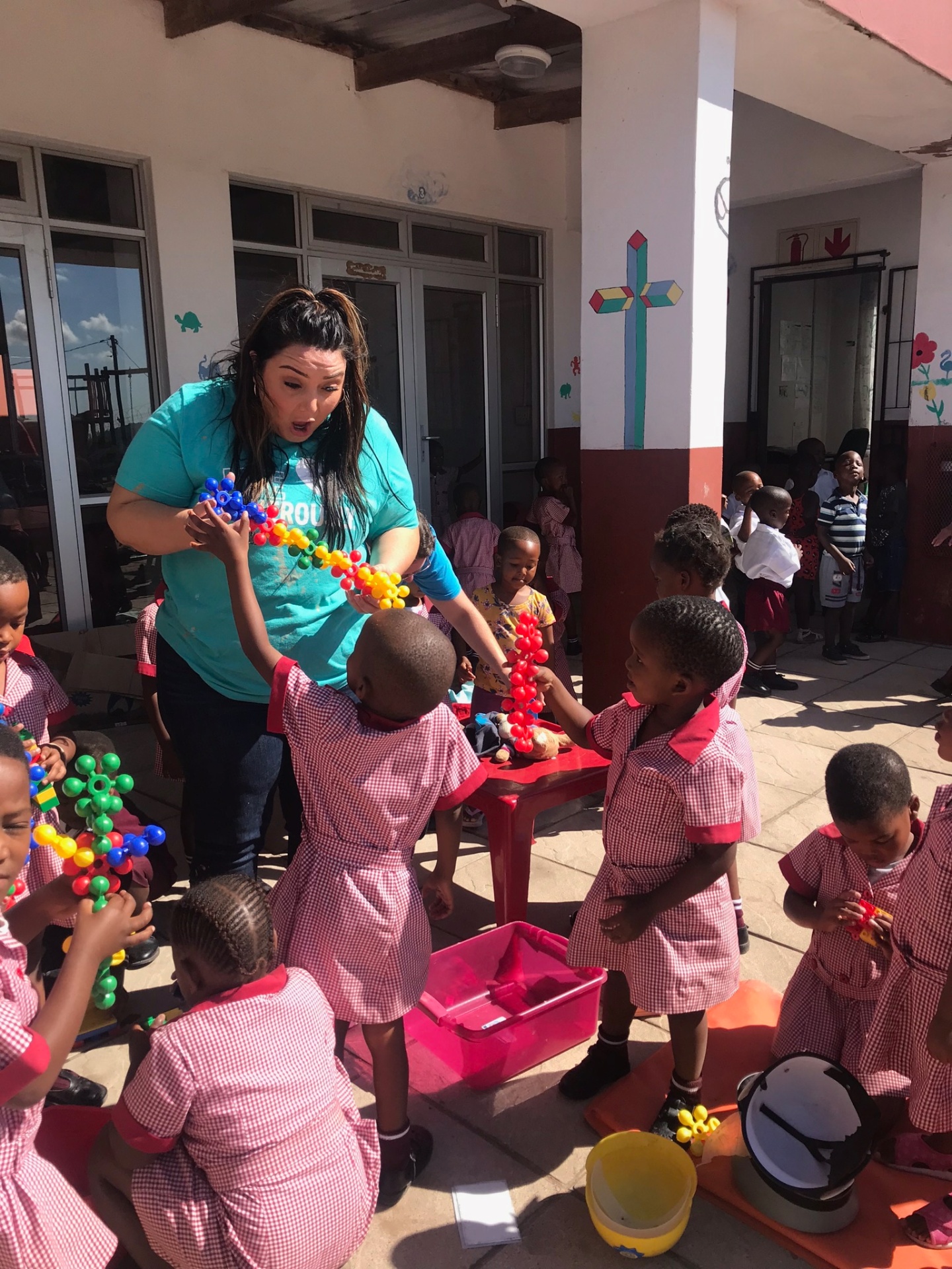 Children building with colorful linking toys