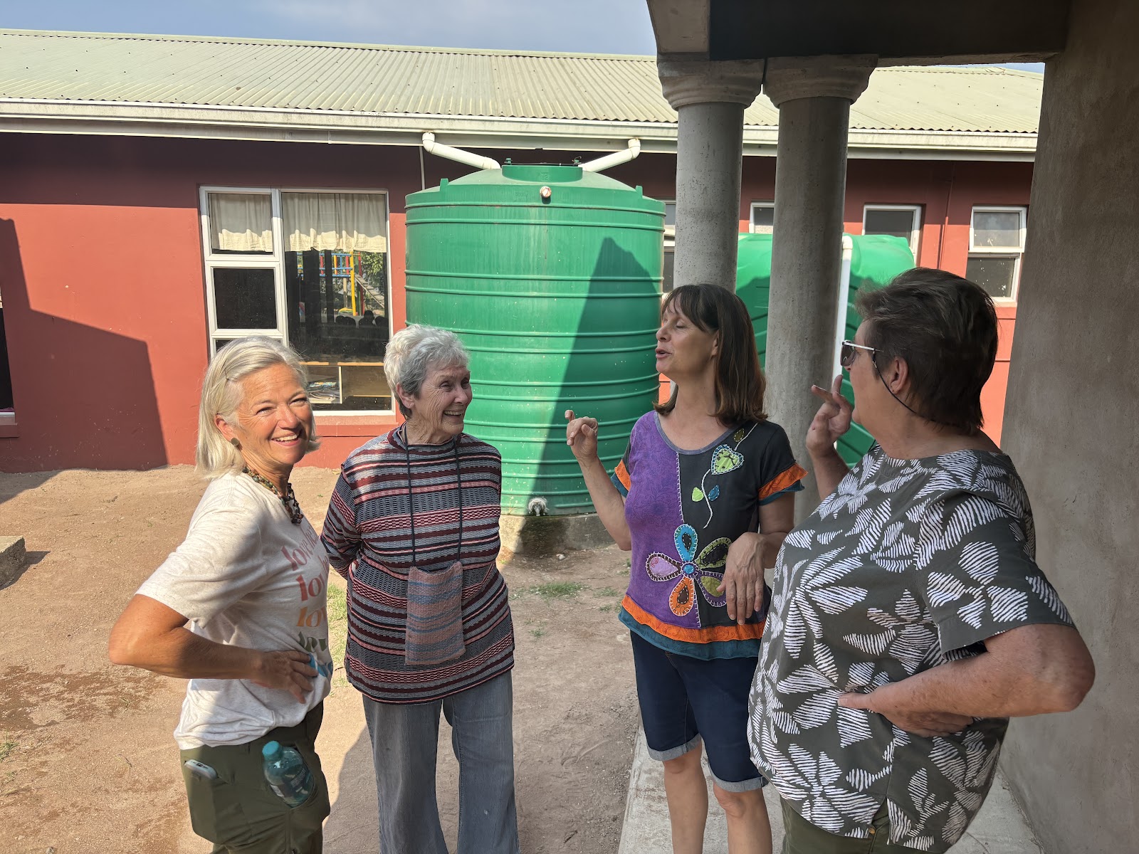 Catching up in front of the mini classroom used for tutoring
